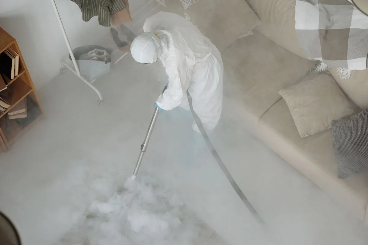 Biohazard cleanup technician in protective equipment, Bellevue, WA